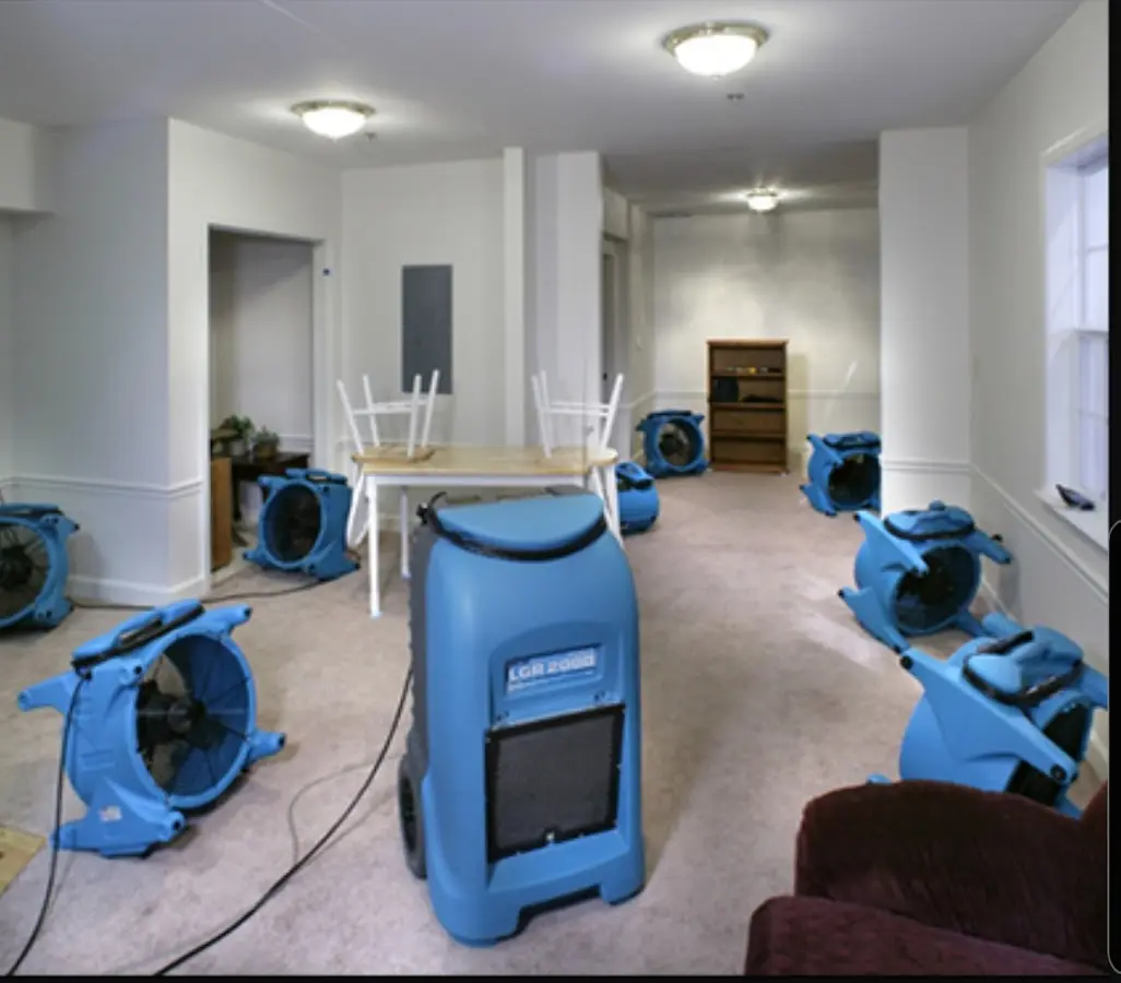 Air movers and dehumidifier setup for Water Damage Restoration in Kenton